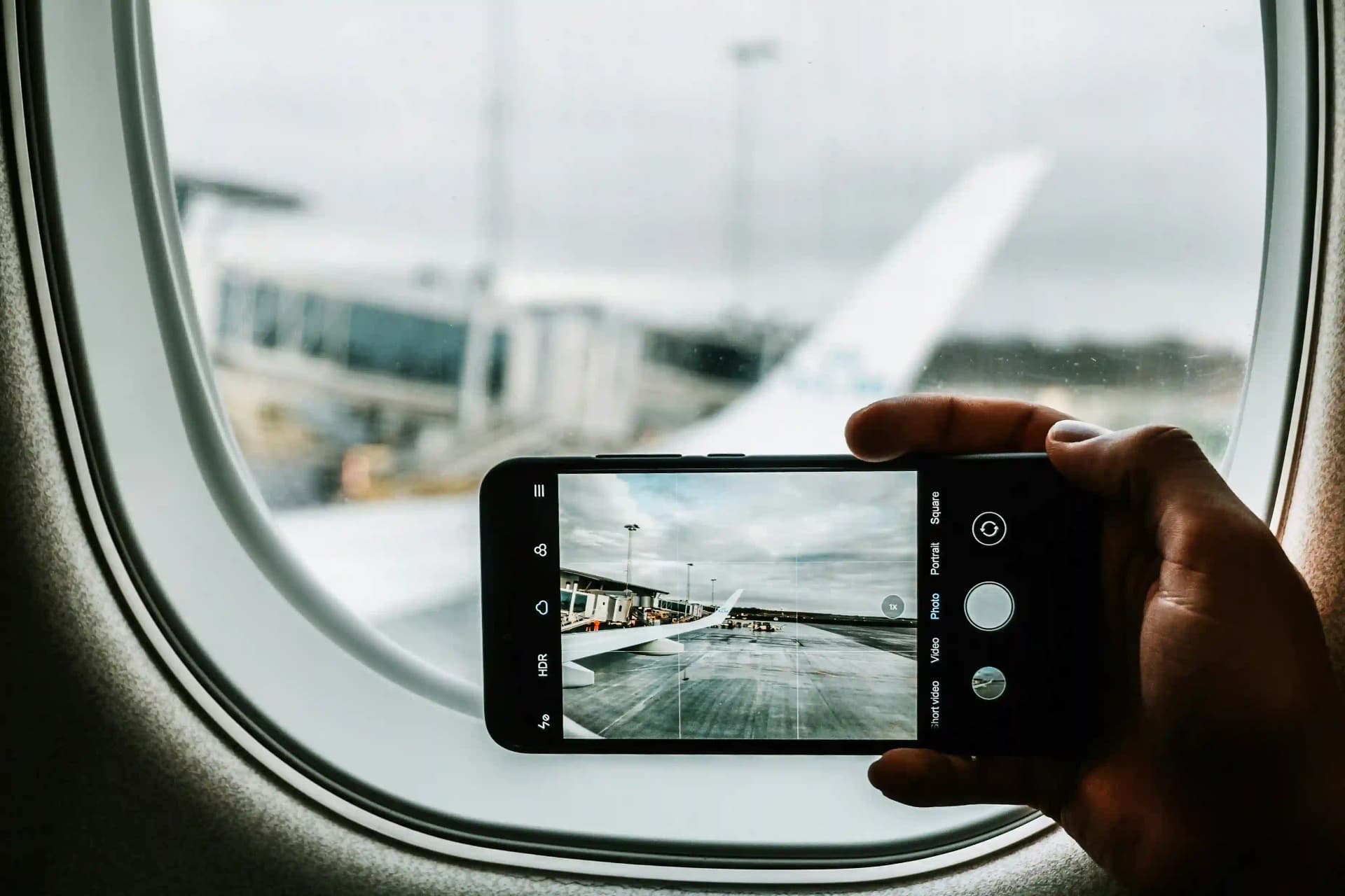 A Guy Holding Phone in Landscape Mode to Shoot image.